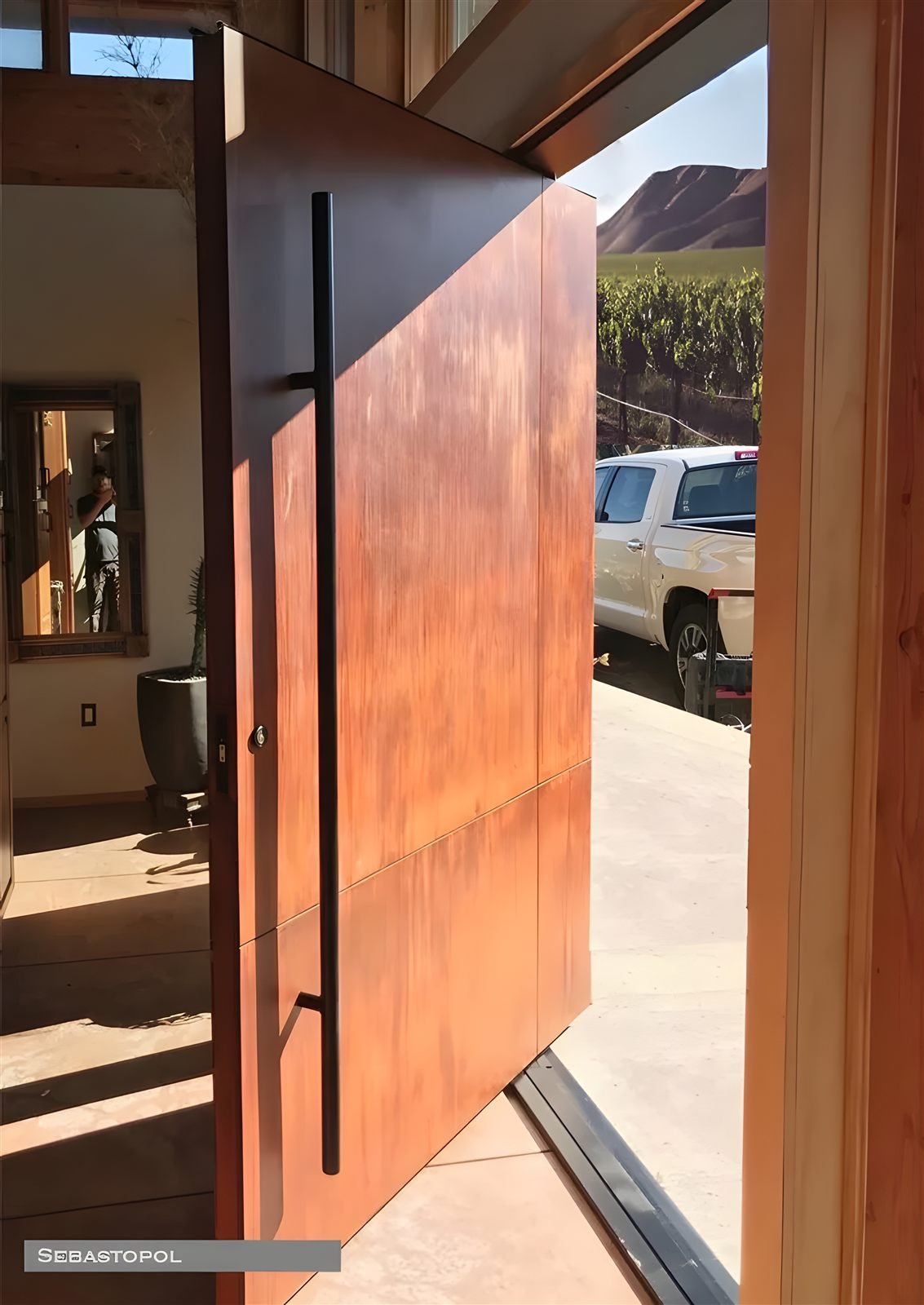 Wood finish aluminum pivot villa door