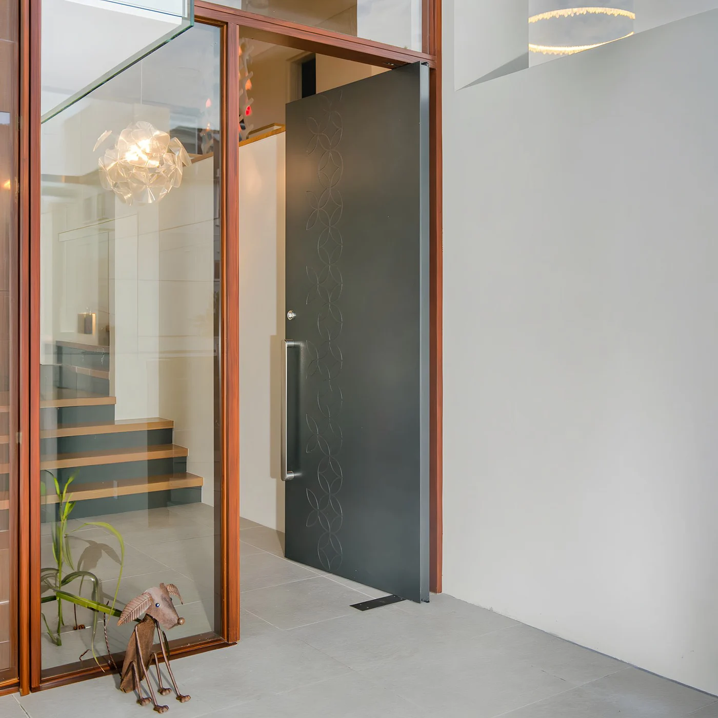 Glazed pivot door design reference 0146 from the AsvntDoor design library